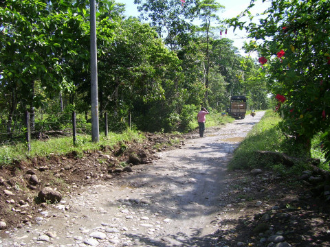 A person walking in a dirt road in a former coca leaf growing vereda in Putumayo