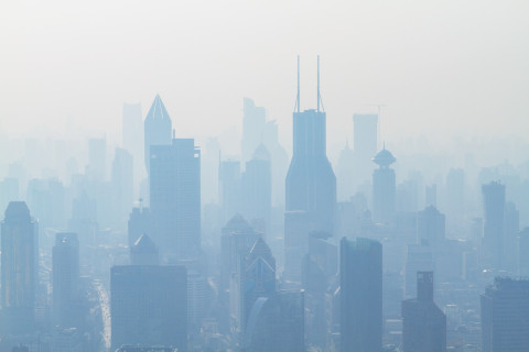 Shanghai’s high rise buildings covered in smoke.  