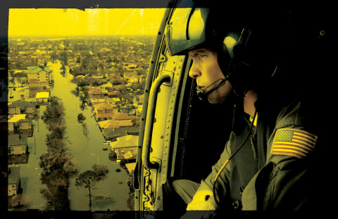 Military helicopter observing aftermatch of Hurricane Katrina
