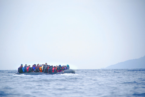 Refugees on a boat crossing the Mediterranean sea, heading from Turkish coast to the northeastern Greek island of Lesbos. Photographer: Mstyslav Chernov/Unframe