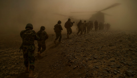 Afghan National Army commandos from the 3rd Commando Kandak and coalition forces board a CH-47 Chinook helicopter after completing a village clearing operation in Mya Neshin district, 