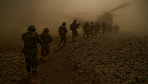 Afghan National Army commandos from the 3rd Commando Kandak and coalition forces board a CH-47 Chinook helicopter after completing a village clearing operation in Mya Neshin district,