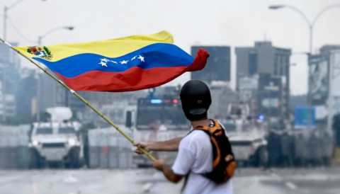 Protester facing the Venezuelan National Guard during a protest in May 2017