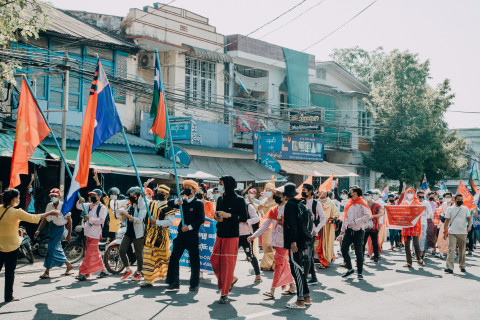 Youth from Mon, Karen, and Pa-O communities joined with approximately 1,000 local people under a banner saying "Revolt any kinds of dictatorship", Date February 11, 2021, Place: Mawlamyine City, Mon State