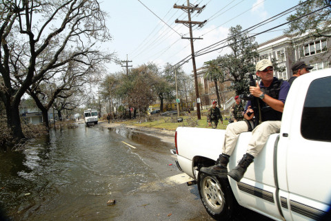 A caravan of various security forces cruises through the flooded streets of the 9th Ward distrtict of New Orleans, in the aftermath of Hurricane Katrina.