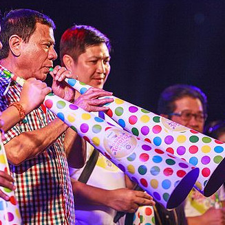 Mayor Rodrigo Duterte leading the blowing of horns during the Torotot Festival 2015 in Davao City