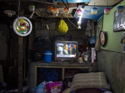 Inside the home of Seventy-year-old Ricardo Medina, a caretaker who lives and works in Pasay cemetery.