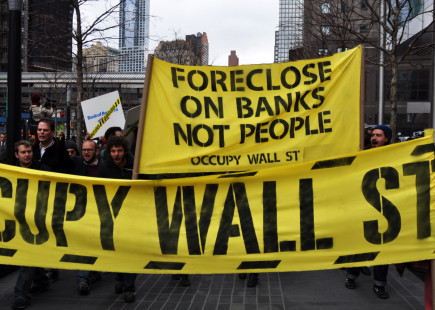 Occupy Bank of America March in 2012. Activists “moved in” to a branch by setting up a sidewalk living room on the theory that ‘the bank took our homes so we’re moving in with them.’