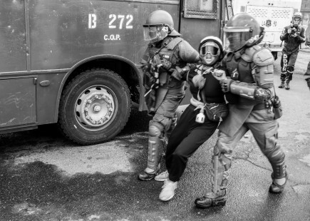 Protestor arrested in Chilean demonstrations. https://www.flickr.com/photos/pauloslachevsky/