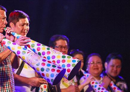Mayor Rodrigo Duterte leading the blowing of horns during the Torotot Festival 2015 in Davao City