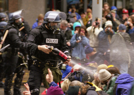 WTO protests in Seattle, November 30, 1999 Pepper spray is applied to the crowd.