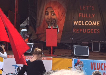 A podium with speakers during the 'refugees welcome rally in Amsterdam 12 September