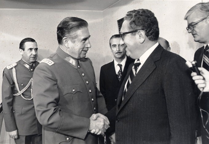 U.S. Secretary of State Henry Kissinger shaking hands with Pinochet in 1976 U.S. Secretary of State Henry Kissinger shaking hands with Pinochet in 1976